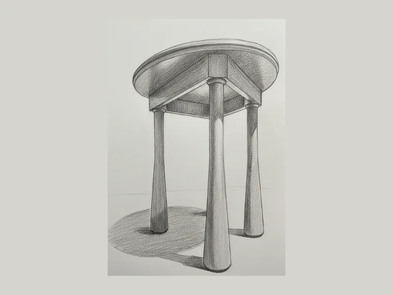 Master artisan hand-carving the Daira side table in solid Sheesham wood